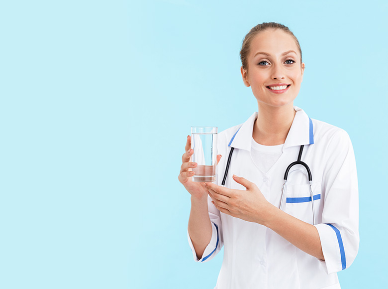 Nurse holding glass of water